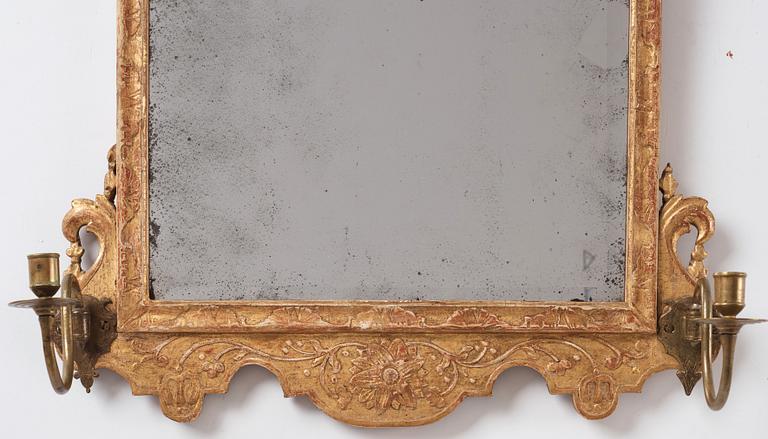 A Northern-European late Baroque two-light giltwood mirror sconce, first part of the 18th century.