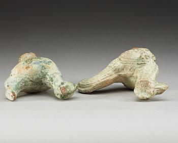A set of two green glazed pottery models of a rooster and a hen, Han dynasty (206 BC- 220 AD).