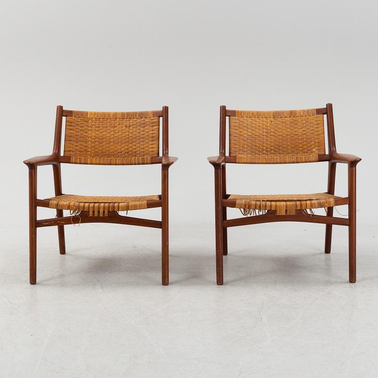 Hans J Wegner, a pair of teak and rattan "JH 516" easy chairs from Johannes Hansen, Denmark, 1950's/60's.