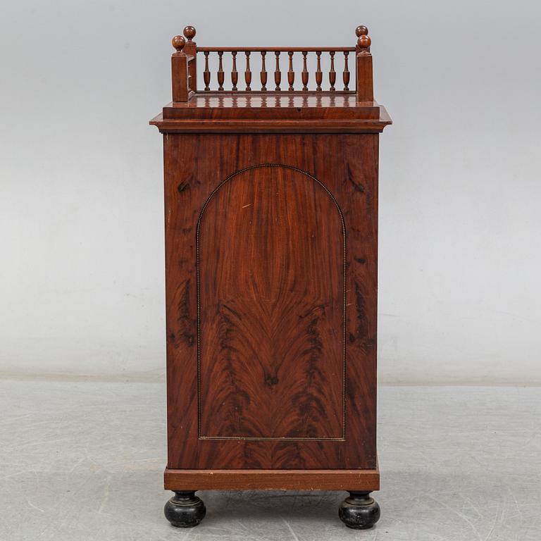 A Swedish Empire cupboard, first half of the 19th century.