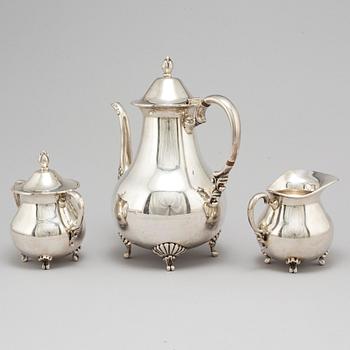 A sterling silver coffee pot, creamer and sugar bowl, 20th century.