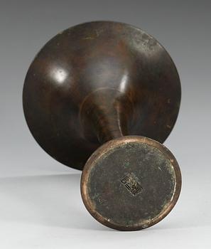 A trumpet shaped 'Archaistic' bronze vessel, Qing dynasty, 18th Century, with seal mark to base.