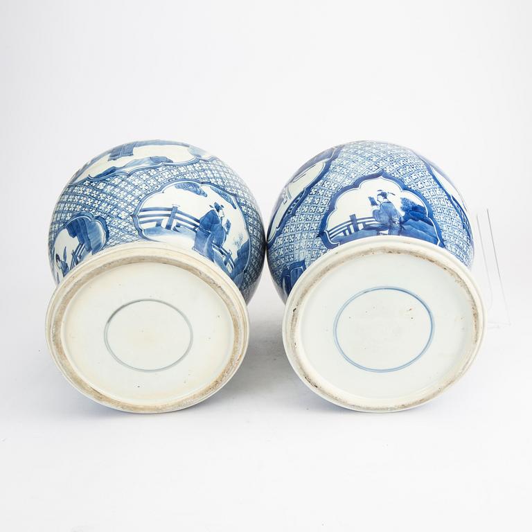 A pair of blue and white porcelain Kangxi style late Qing urns.