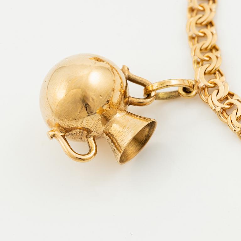 Bracelet, 18K gold bismarck link. With charms.