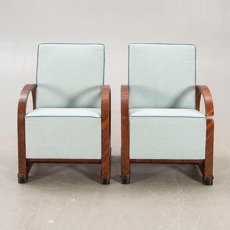 A pair of Art deco walnut armchairs first half of the 20th century.