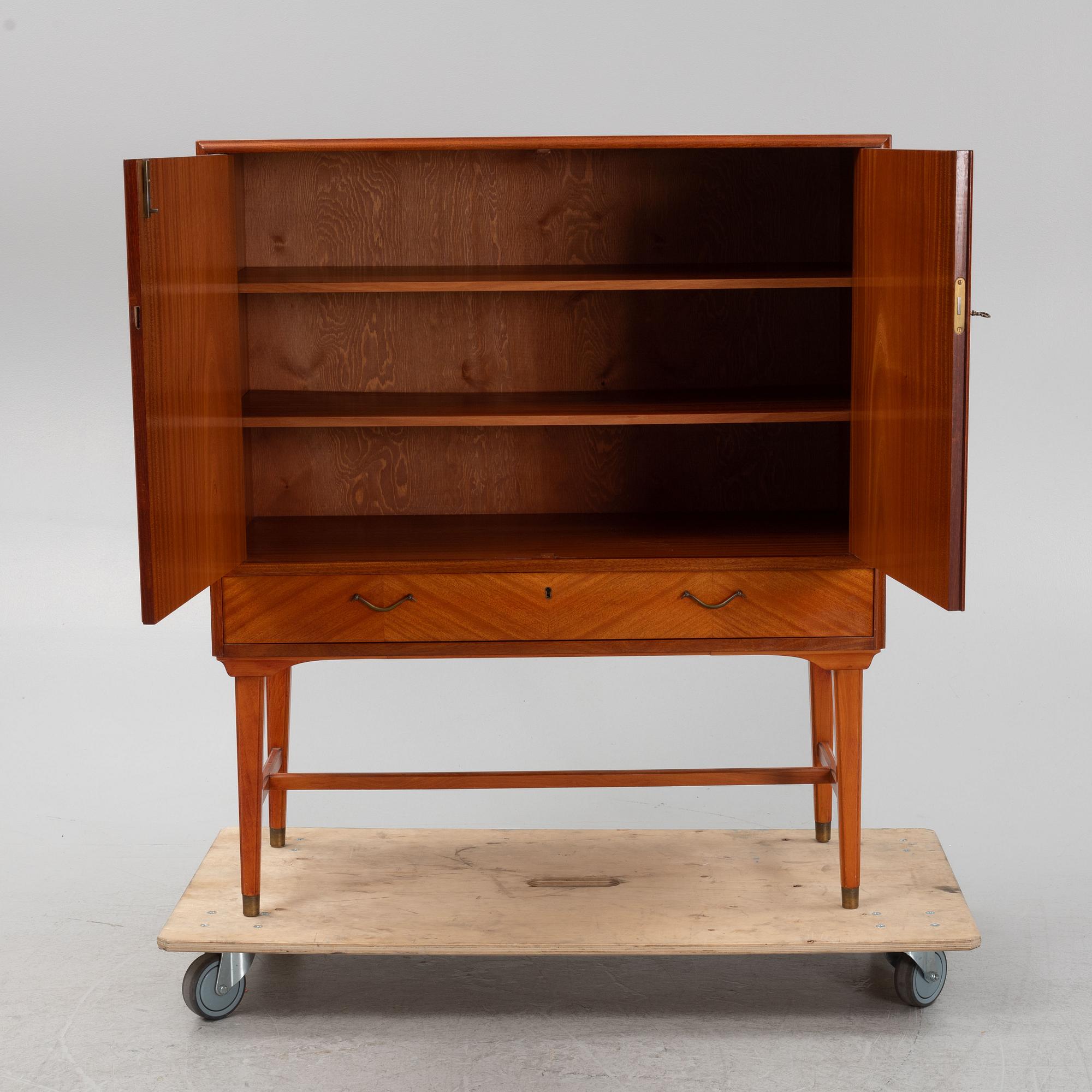 A mahogany veneered cabinet, 1940s/50s.