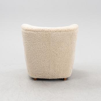 A lounge chair with new sheepskin upholstery, Denmark, 1940's.