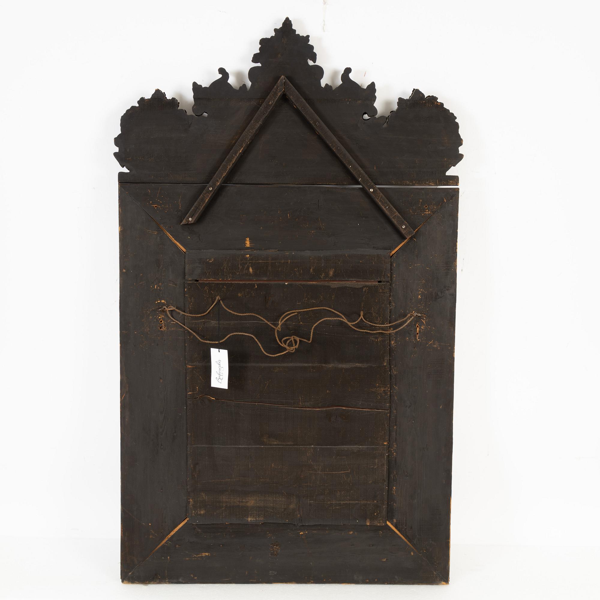 A Baroque style repoussé mirror, circa 1900.