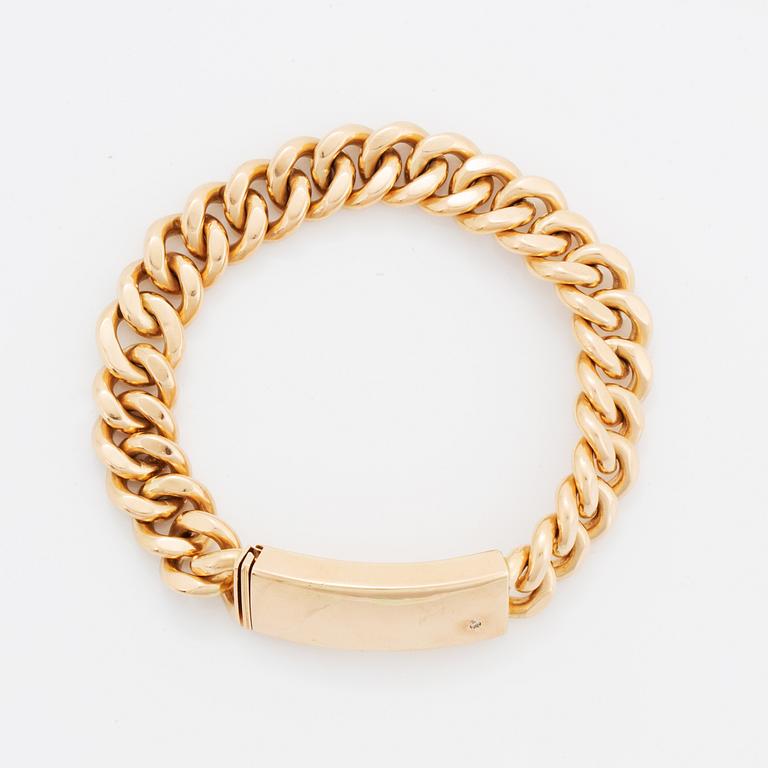 A 14K gold bracelet.