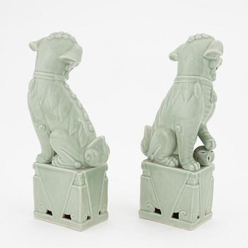 A pair of celadon glazed figures of buddhist lions, China, 20th Century.