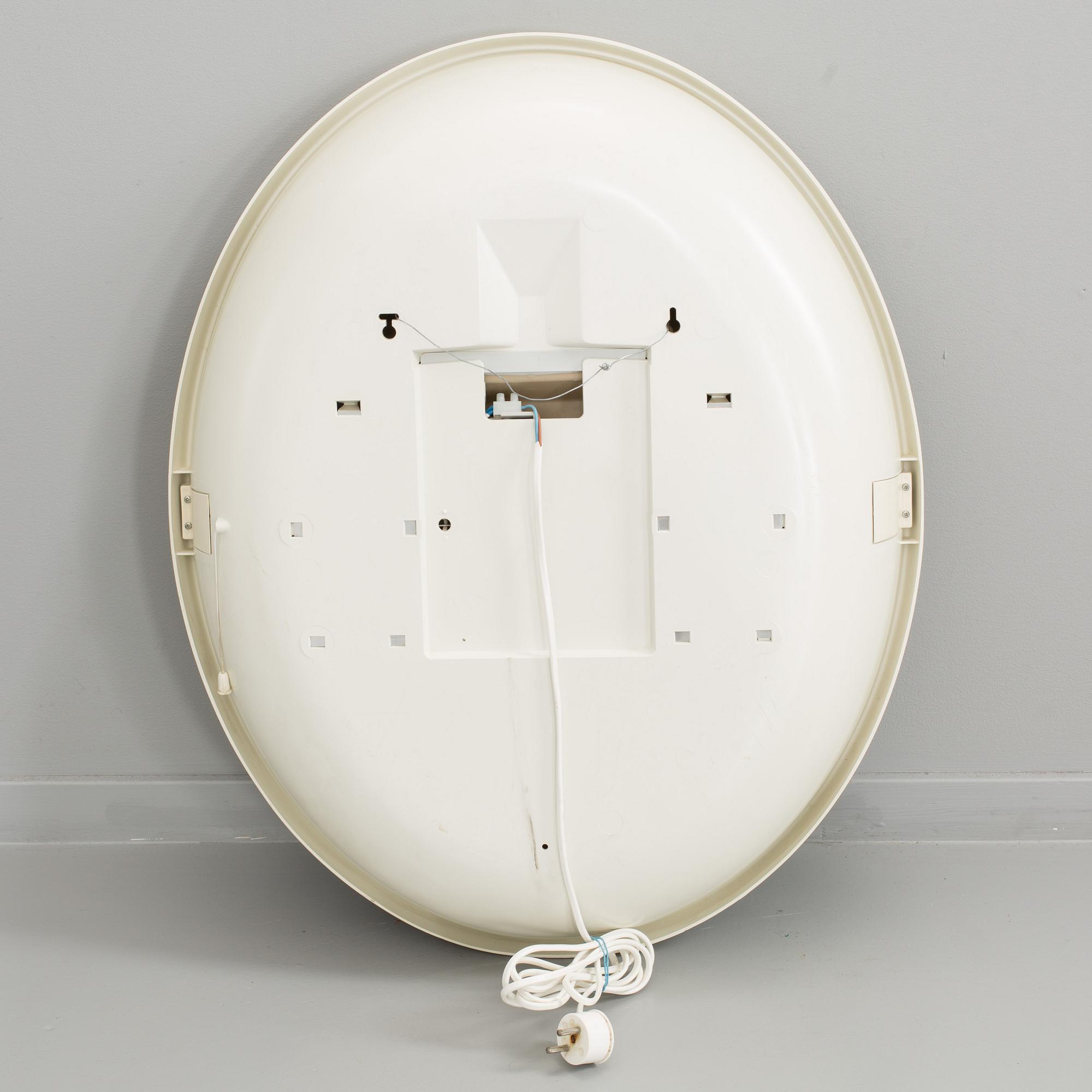 A "SPACE AGE" WALL MIRROR WITH LIGHT BY ALLIBERT, 1970´s.