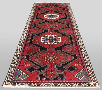 A semi-antique runner carpet, 295 x 100 cm.