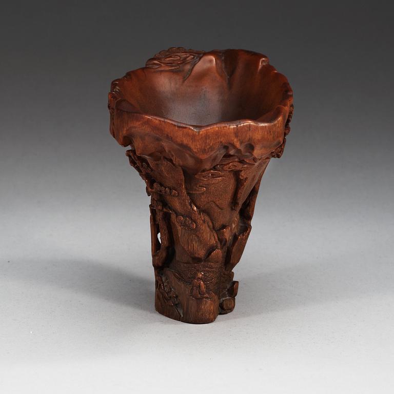 A finely carved rhinoceros libation cup, Qing dynasty, Kangxi (1662-1722).