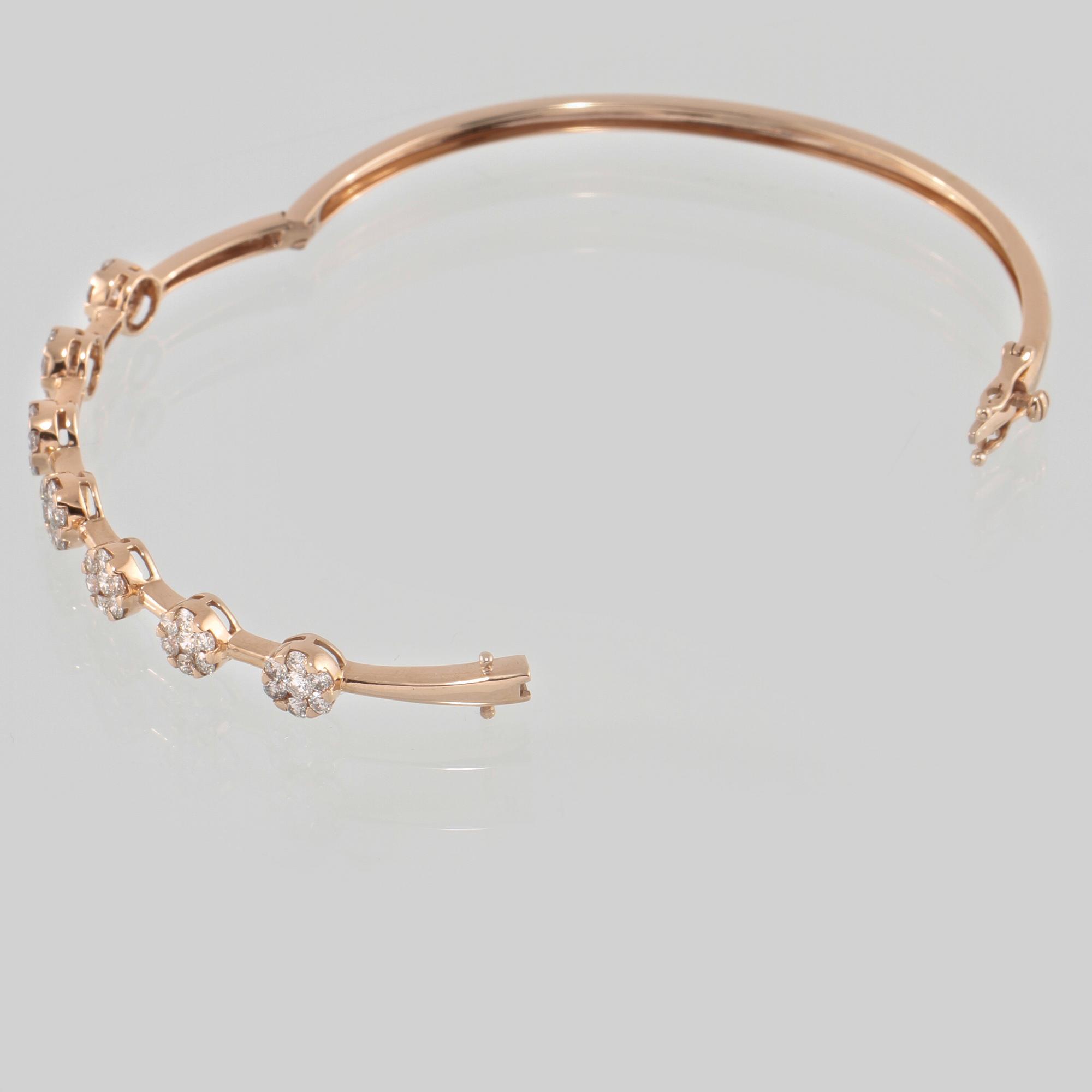 ARMRING, 18K guld med briljantslipade diamanter 1.50 ct. Vikt 10,2 gram.