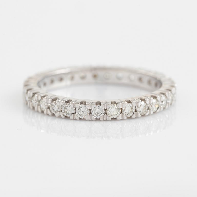 Brilliant cut diamond eternity ring.