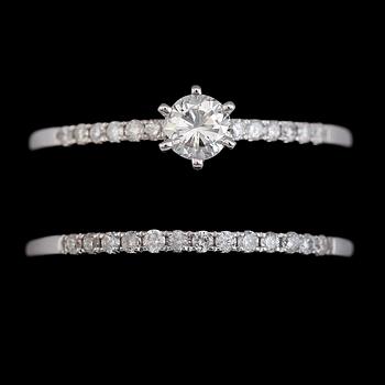 RINGAR, 2 st, 14K vitguld, briljantslipade diamanter tot ca 0.50 ct. Vikt ca 3 g.