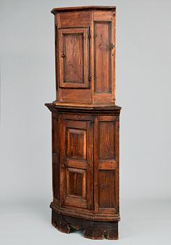 13. A CORNER CABINET.