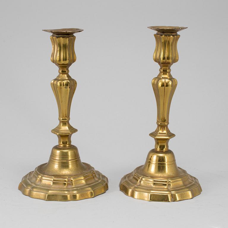 A pair of 18th century bronze candlesticks.