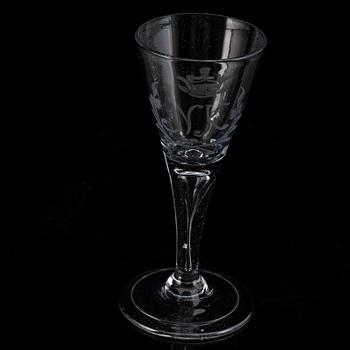 A wine glass, 18th Century, with the monogram NK beneath a noble coronet.