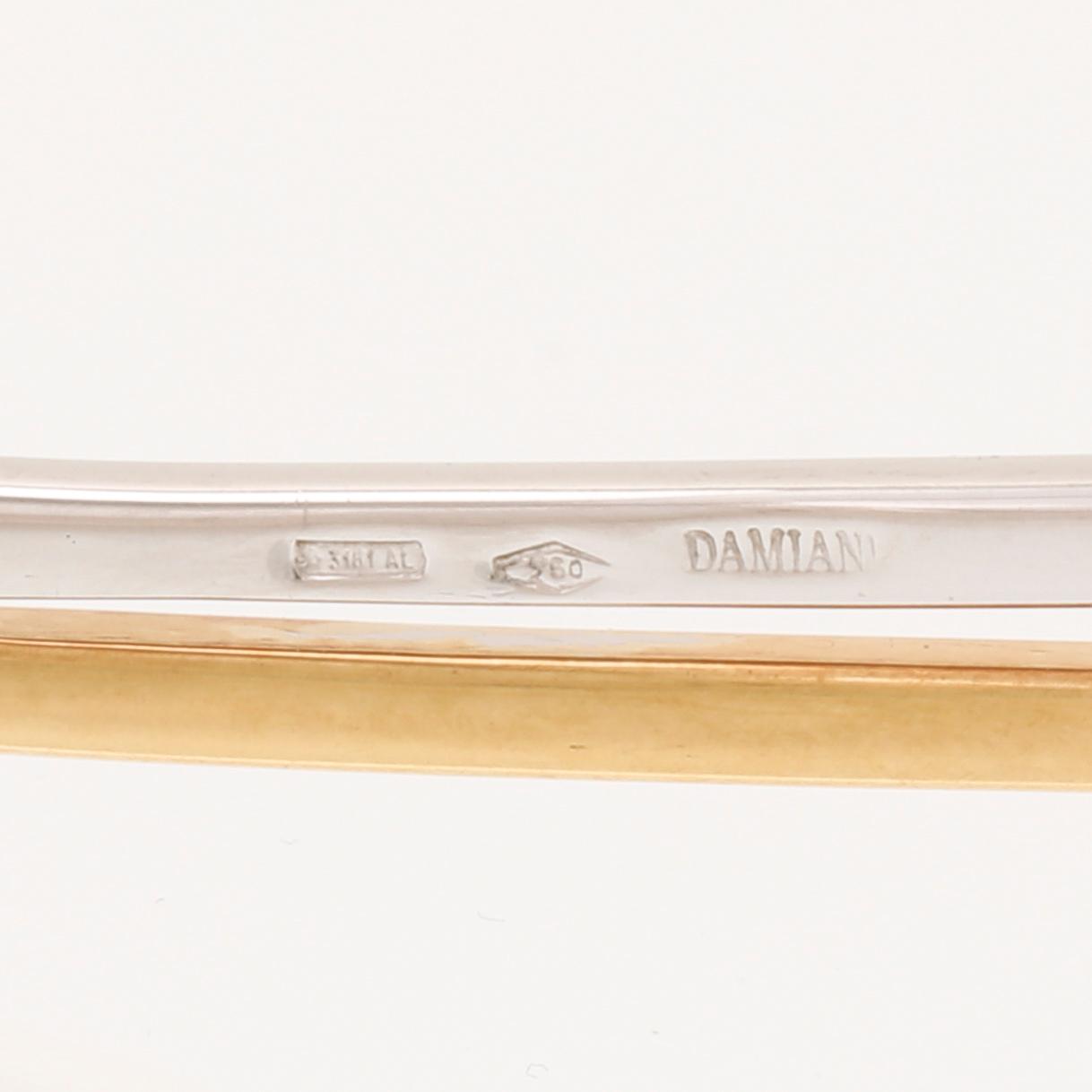An 18K white- and yellow gold necklace with round brilliant cut diamonds and cultured Tahitian pearls, Damiani Italy.