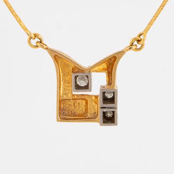 A Björn Weckström 18K gold necklace with brilliant-cut diamonds.