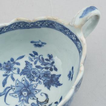 A blue and white vegetable tureen with cover and a sauce boat with a dish, Qing dynasty, 18th Century.