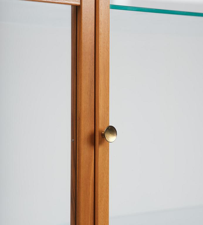 Josef Frank, a walnut showcase cabinet model "B 2077", Firma Svenskt Tenn.