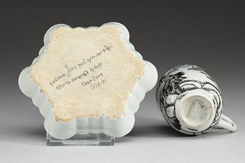 A Grisaille 'European subject' cup and dish, Qing dynasty, Qianlong (1736-95).