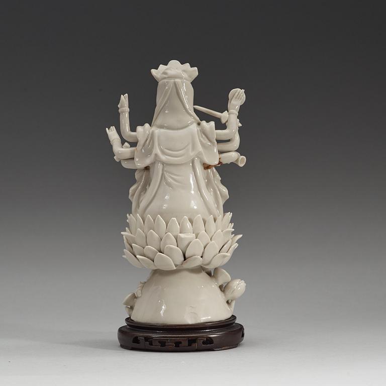 An eigth armed blanc de chine figure of a Bodhisattva, Qing dynasty, 19th Century.