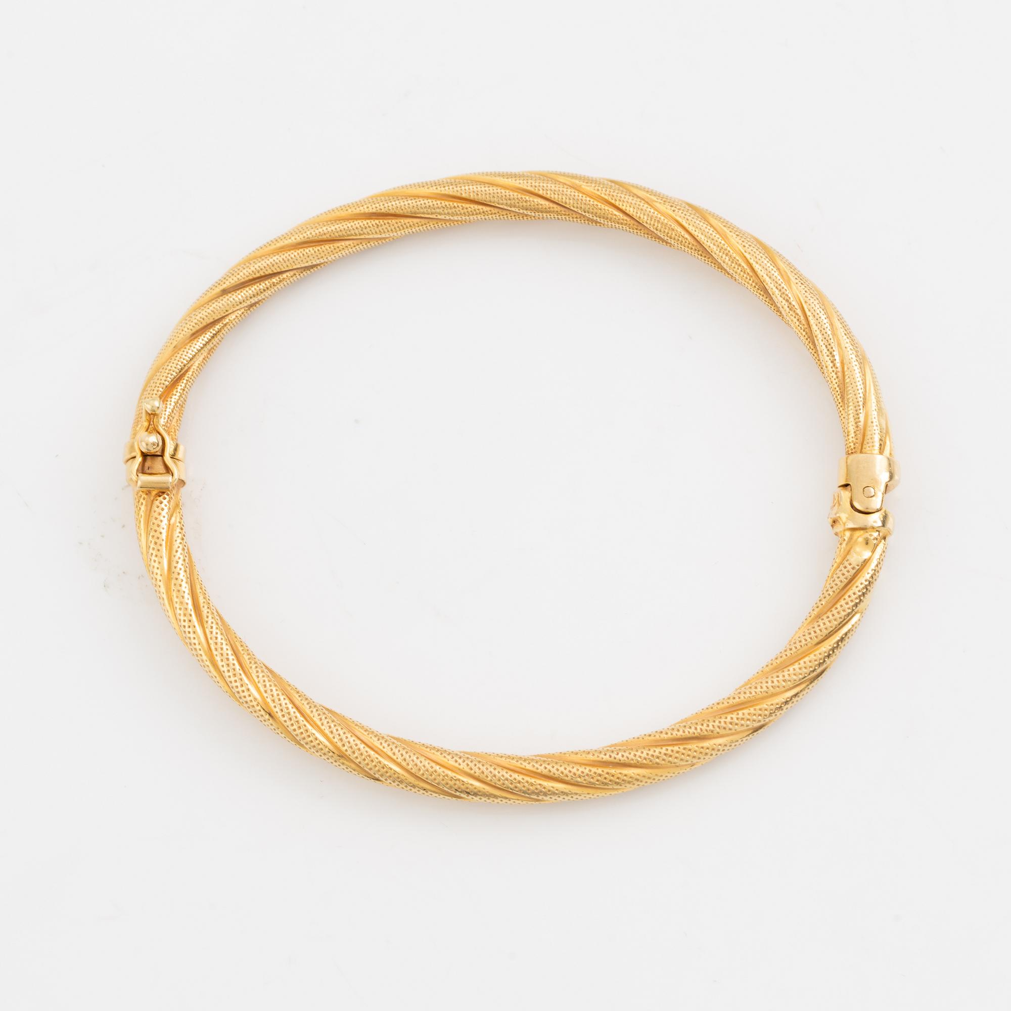 Armring, vriden dekor, guld.