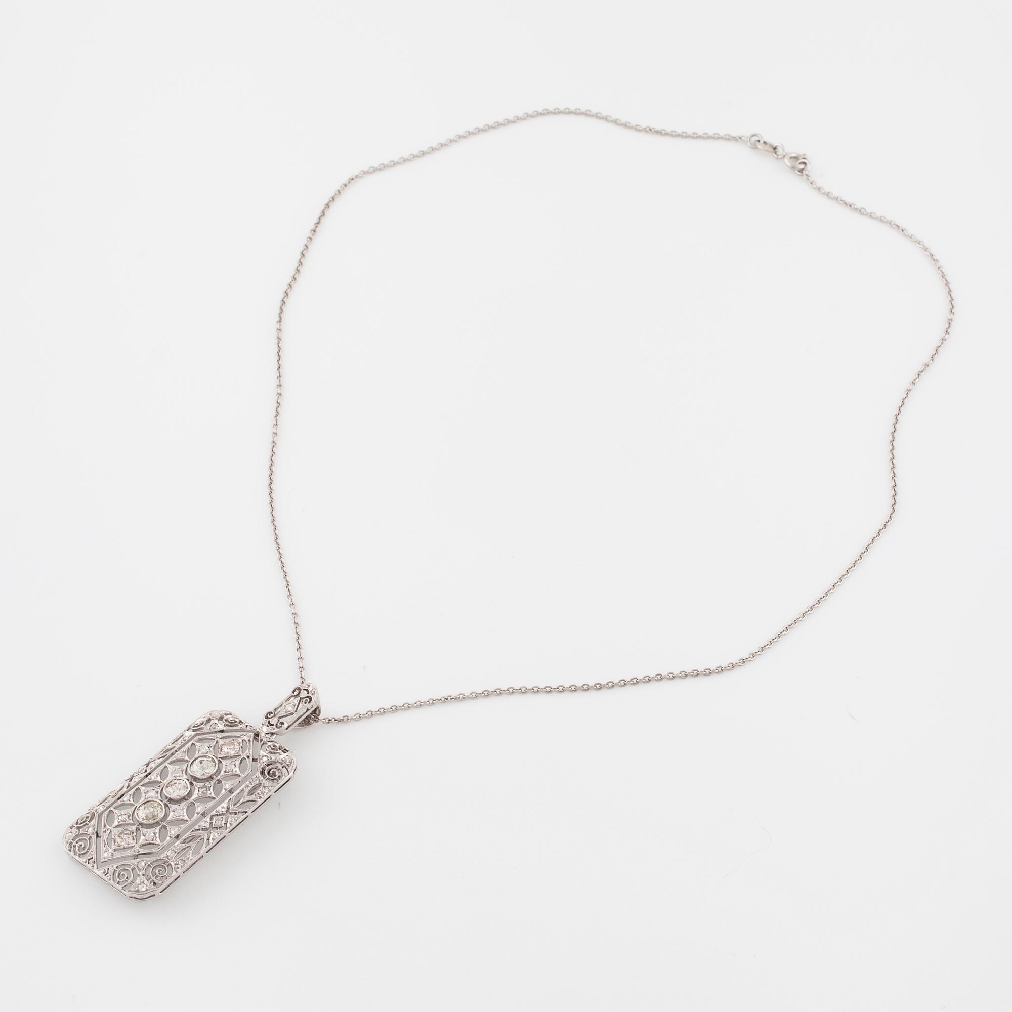 COLLIER/BROSCH, med rosen- och gammalslipade diamanter.