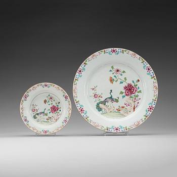 1575. A large famille rose 'double peacock' serving dish and five soup dishes, Qing dynasty, Qianlong (1736-95).