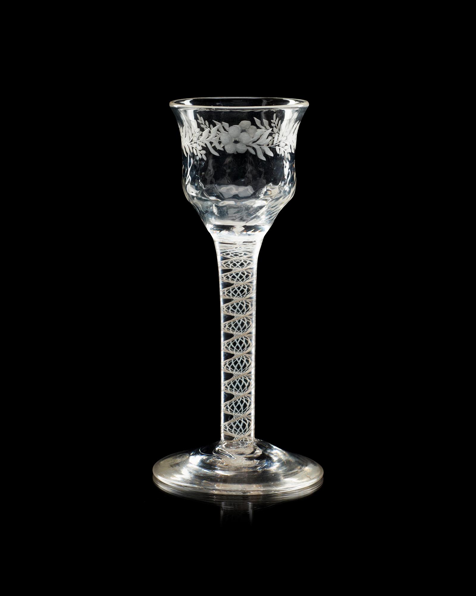 An engraved wine glass, 18th Century, presumably English.