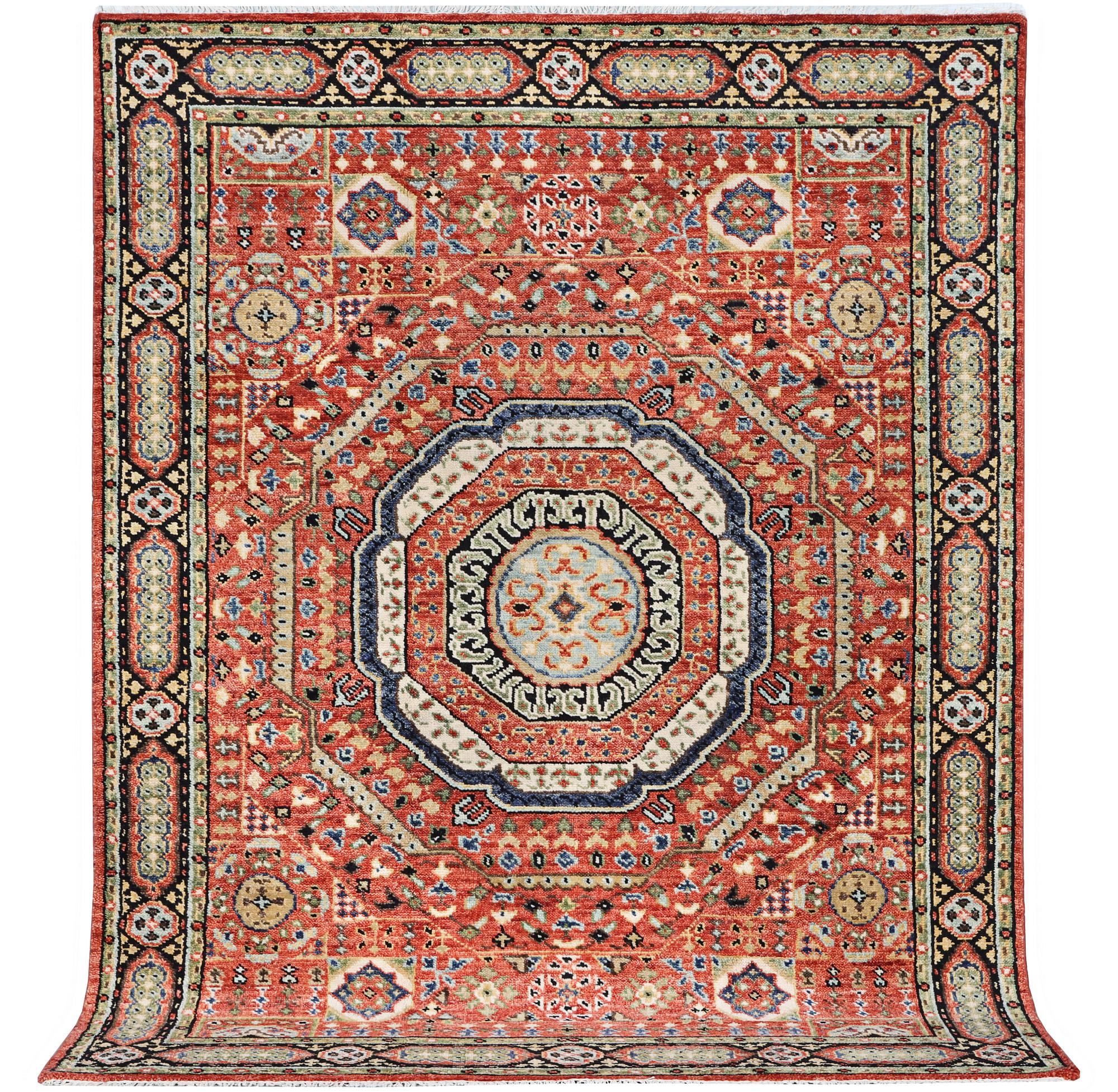 A carpet of Mamluk design, c. 307 x 243 cm.