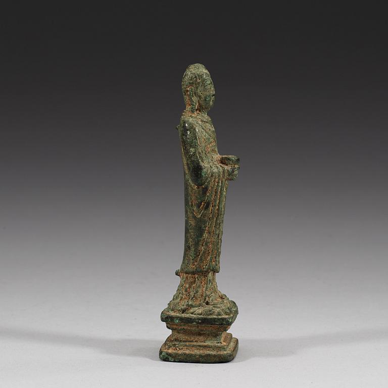 A standing bronze Buddha, presumably Tang/Liao dynasty (618-1125).