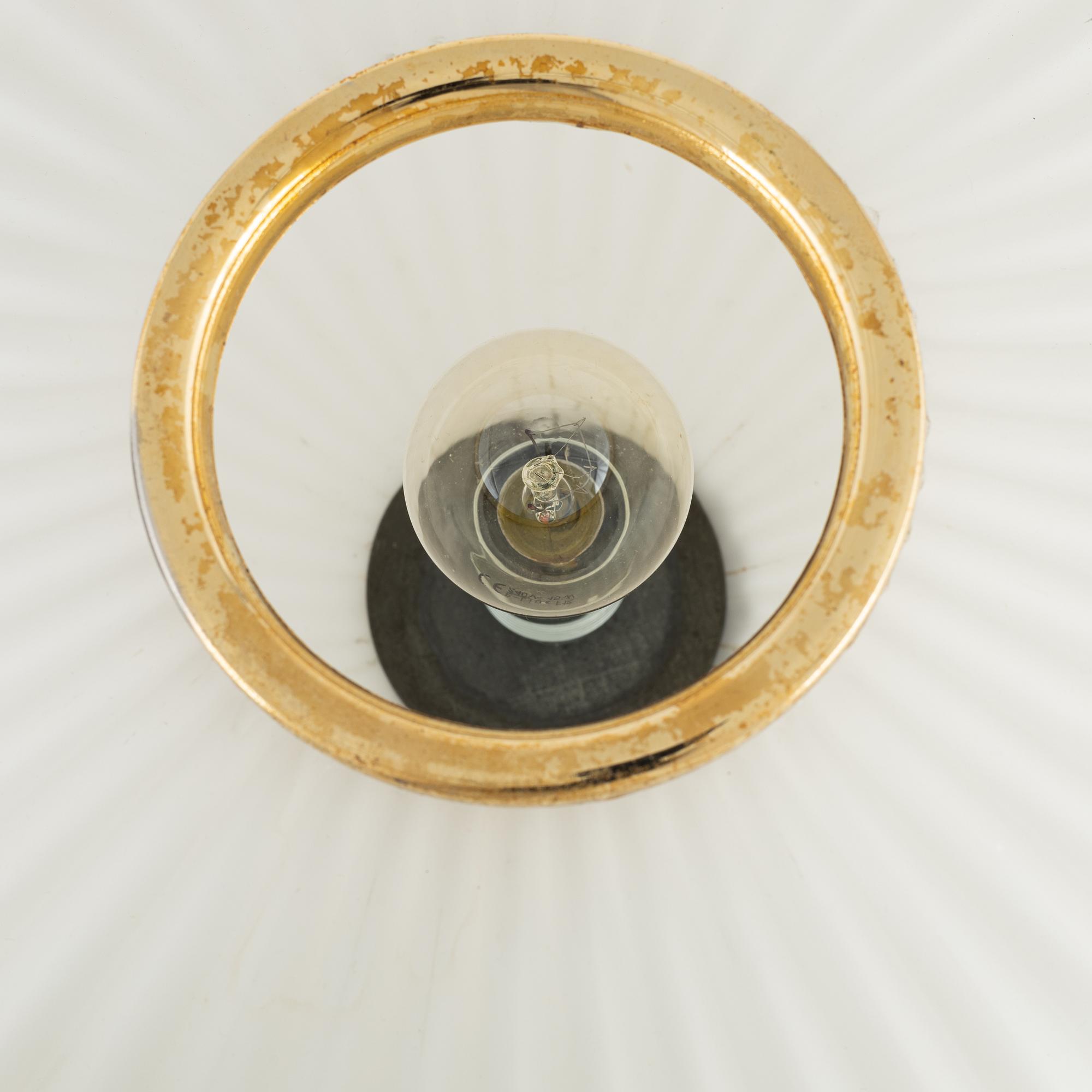 A glass and metal table lamp, probably Italy, 1960s.