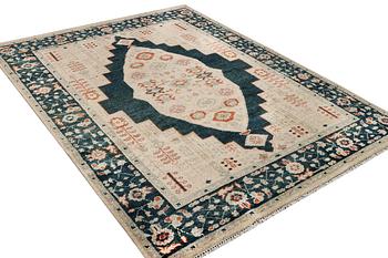 An oriental carpet with Mamluk design, c. 307 x 237 cm.