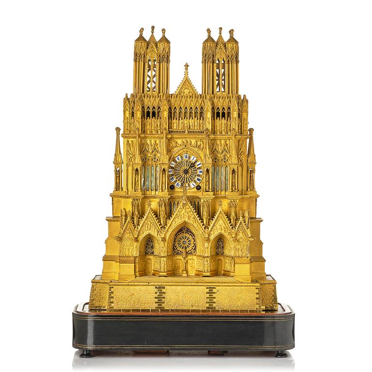 A Charles X ormolu mantel clock modelled as the Cathedral of Reims, Paris, 1820's.