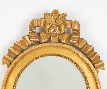 A pair of Gustavian style two-light giltwood girandole mirrors, 20th century.