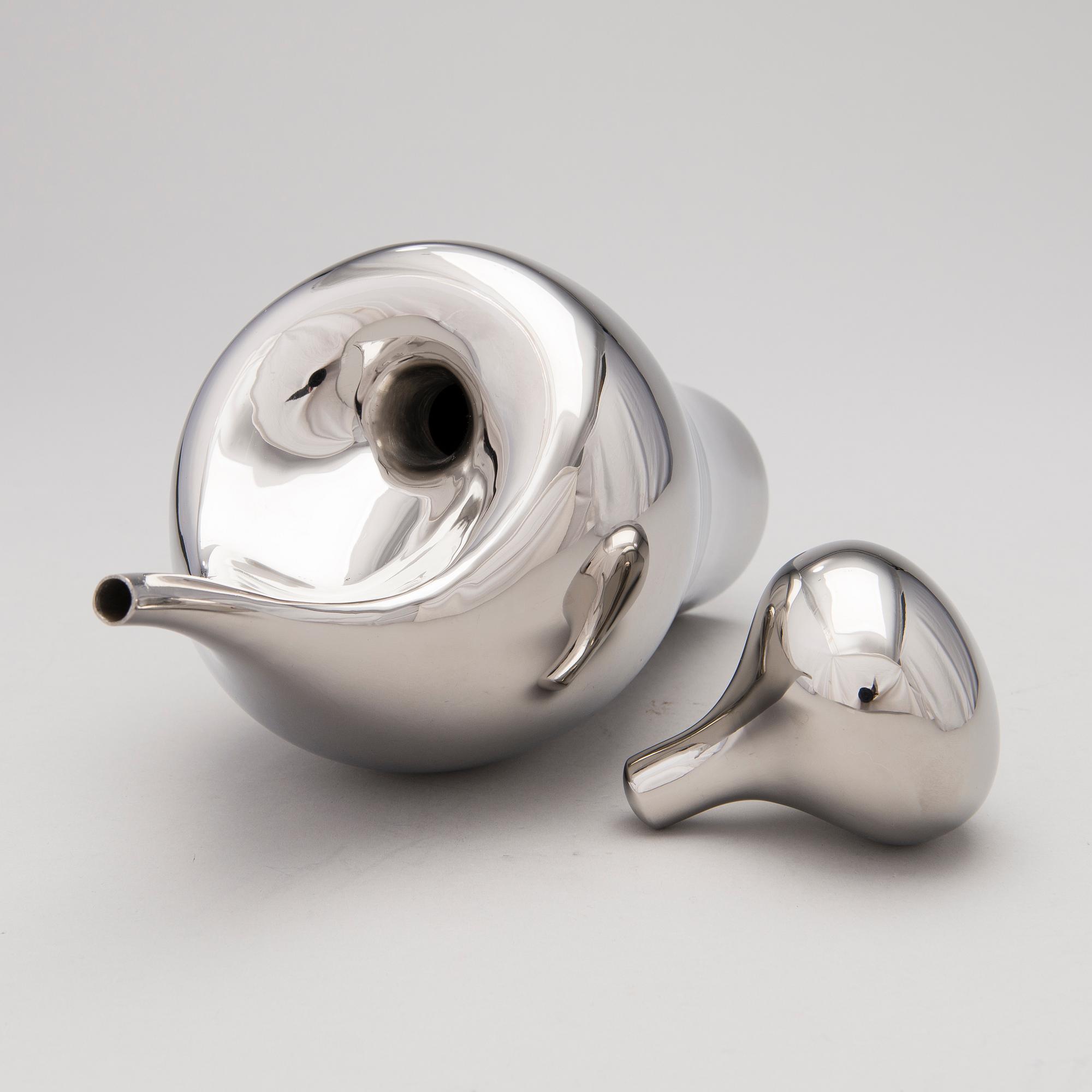 A GEORG JENSEN PITCHER, steel, design Aldo Bakker.