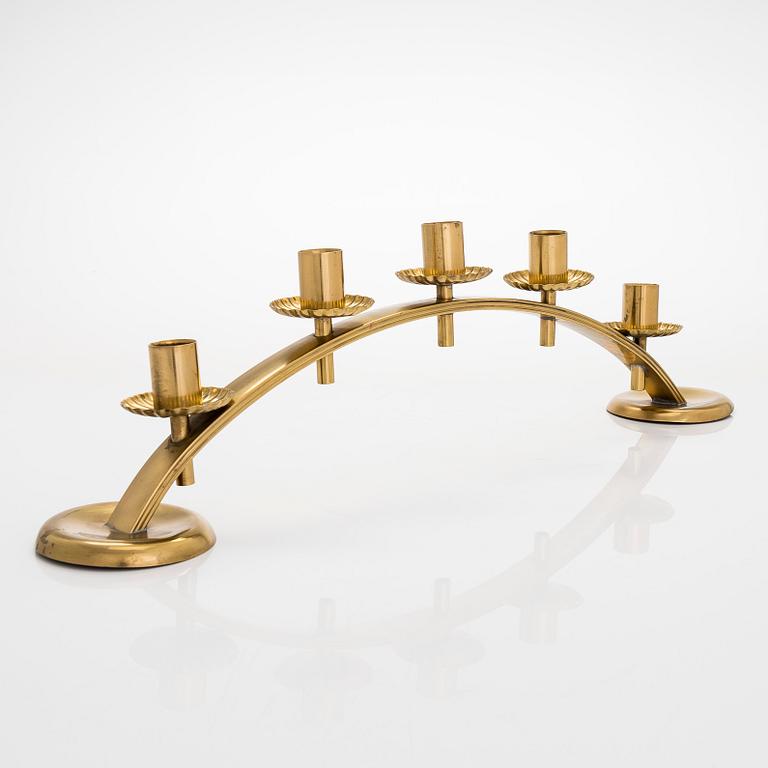 A mid-20th century brass candle holder, Idman.