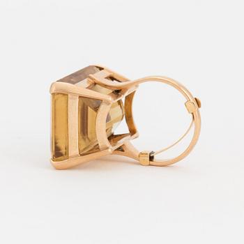 A ring set with a step-cut citrine.
