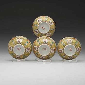 A set of four yellow ground famille rose bowls with covers, early 20th century with Guangxu six character mark in red.