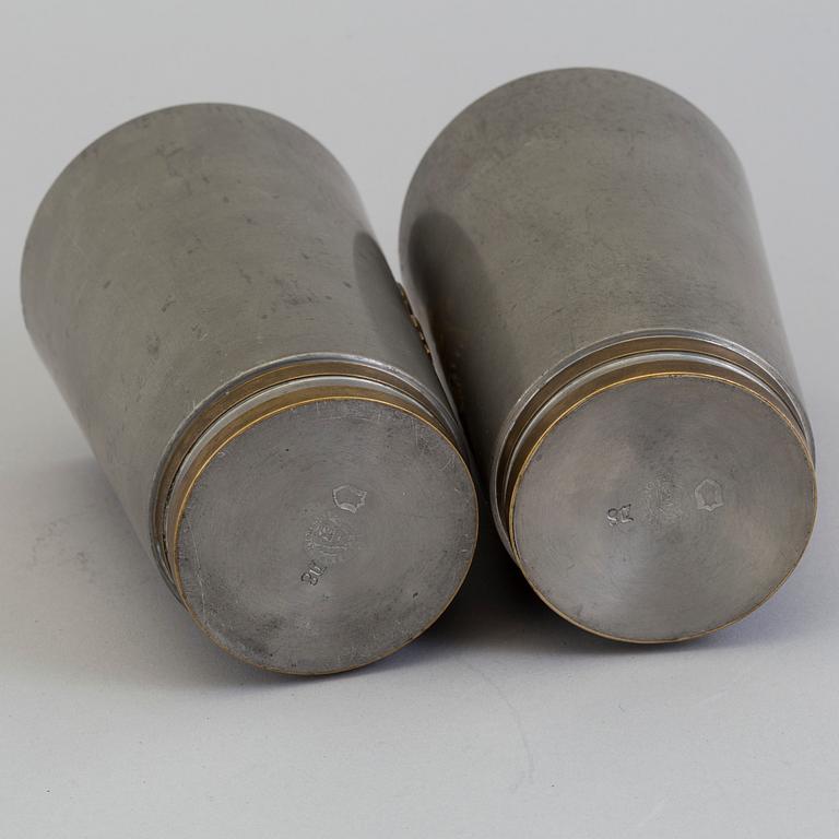 2 pewter beakers by Firma Svenskt Tenn" dated 1930.