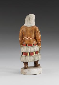 A Russian bisquit figure of a Samoyed woman from Mezen, Central Porcelain Trust, Dimitrovski, Verbilki, Moscow, 20th Century.