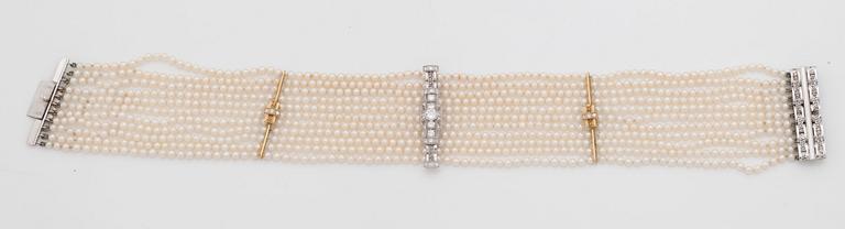 A cultured saltwater pearl and diamond choker necklace. Total carat weight 1.00 ct.