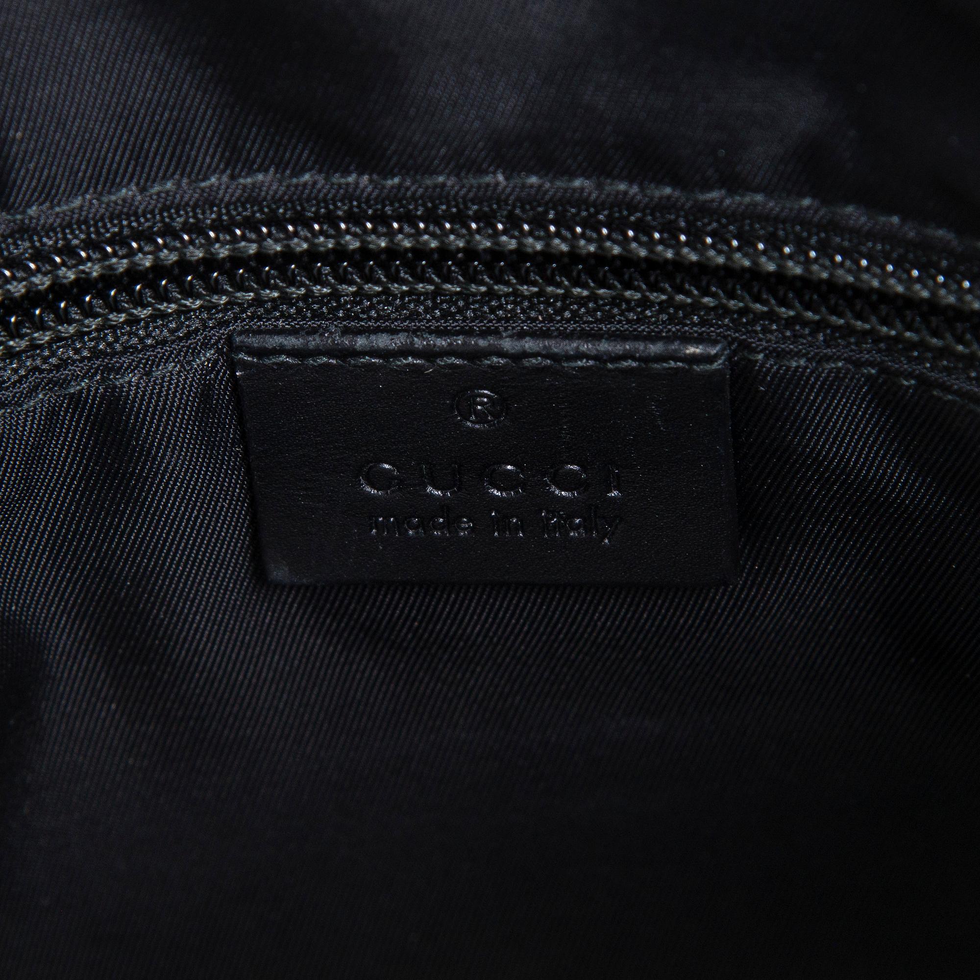 Gucci, a "Techno Canvas Web Messenger" bag.