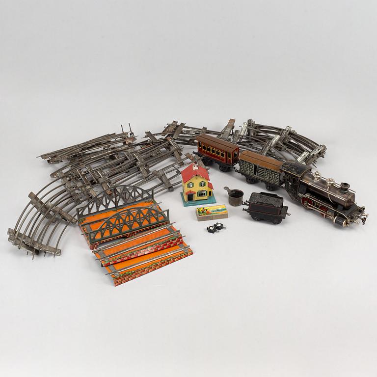 A steam engine wirt tender and wagons, early 20th century.