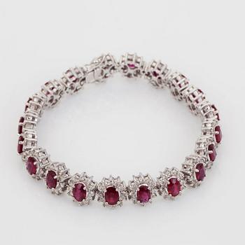 An oval-cut ruby and brilliant-cut diamond bracelet.