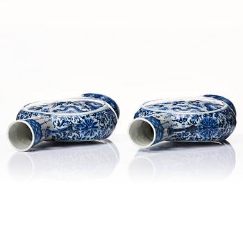 A pair of Chinese blue and white pilgrim vases, Qing dynasty, 19th Century.